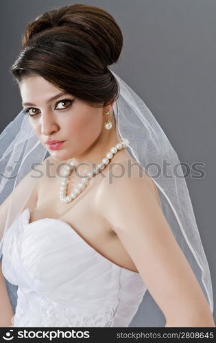 Bride in wedding dress in studio shooting