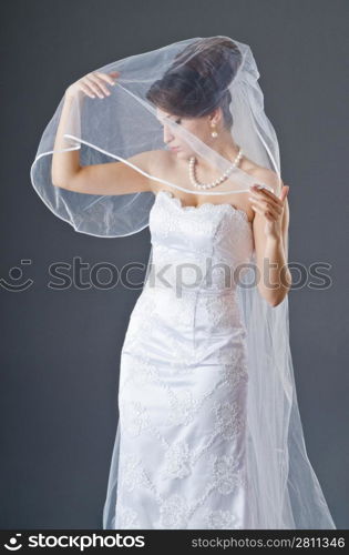 Bride in wedding dress in studio shooting