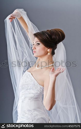 Bride in wedding dress in studio shooting