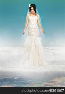 Bride in Wedding White Dress standing on a Cloud and Looking to the Ground