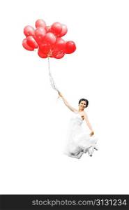 bride in white dress with balloons on green field