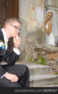 bride looking at groom, goom unfocused