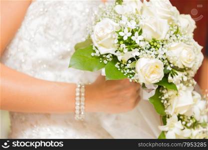 Bride on her special day with her bouquet in hand