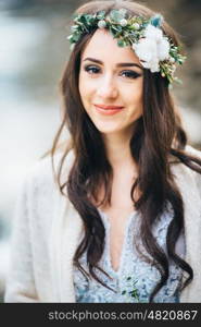 bride on the background of a mountain waterfall