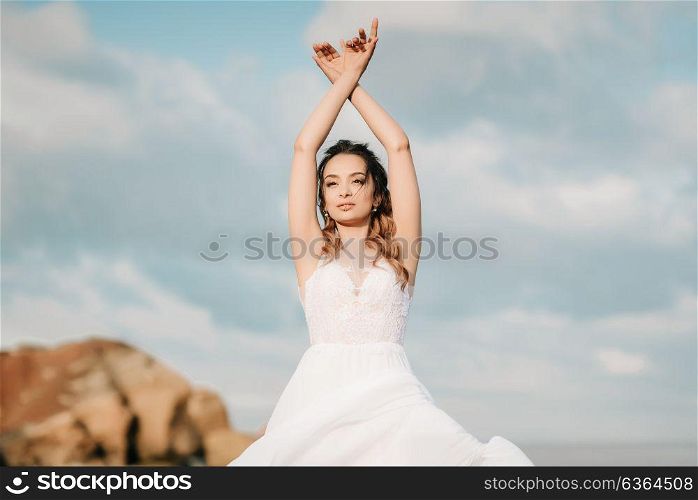 bride on the shore of the black sea in the sunset light