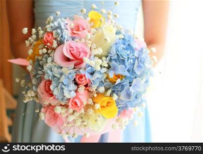 Bride or bridemaid with bouquet, closeup
