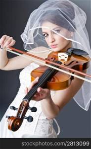 Bride playing violin in studio