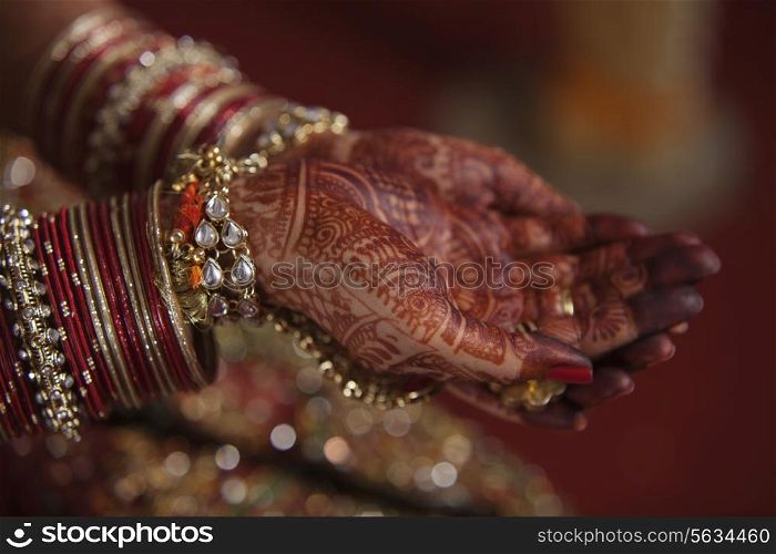 Bride&rsquo;s hands covered with henna