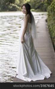 Bride standing on a boardwalk