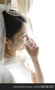 Bride talking with cell phone