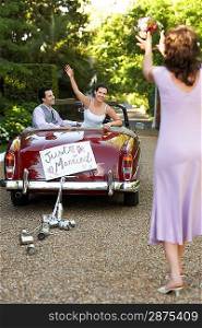 Bride Tossing Bouquet from Car