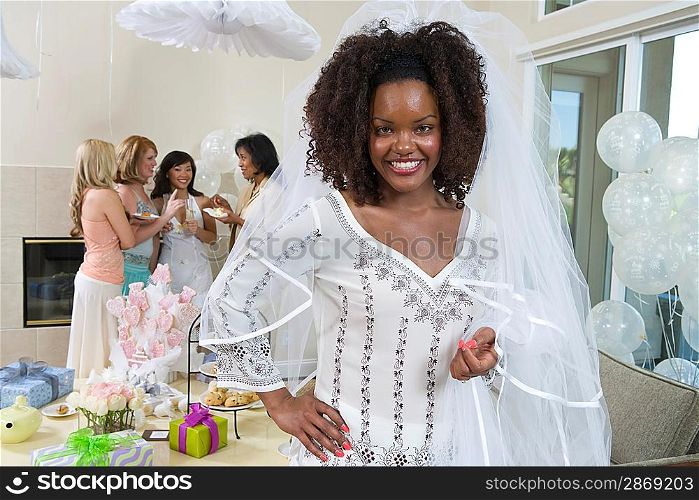 Bride wearing veil at bridal shower