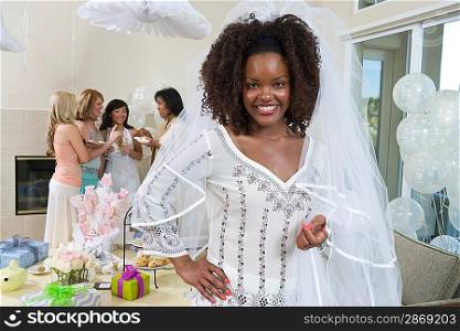Bride wearing veil at bridal shower