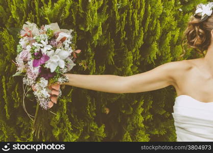 Bride with a Beautiful Bouquet of Flowers