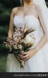 bride with bouquet of flowers