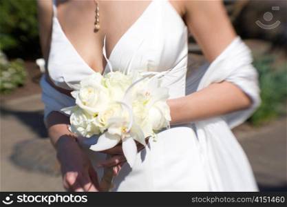 Bride with Bouquet of White Roses and Orchid