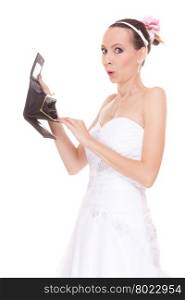 Bride with empty wallet. Young girl holding purse looking for money cash. Wedding expenses costs, expenditure. Finance concept. Woman in white wedding dress isolated on white background.