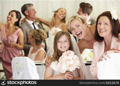 Bride With Grandmother And Bridesmaid At Wedding Reception