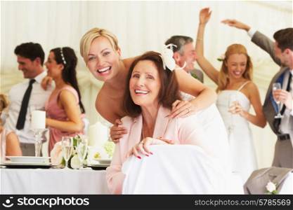 Bride With Grandmother At Wedding Reception