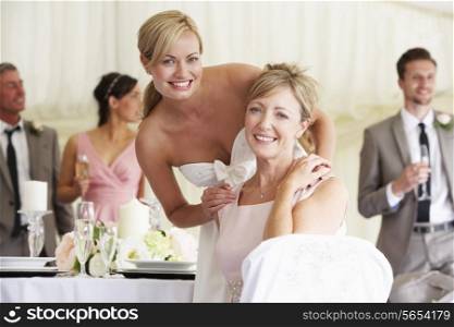 Bride With Mother At Wedding Reception