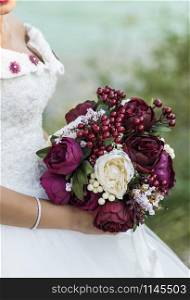 Bride with rose flowers in your hand