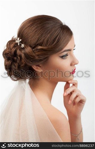 bride with wedding hairstyle and veil on a white background