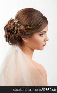 bride with wedding hairstyle and veil on a white background