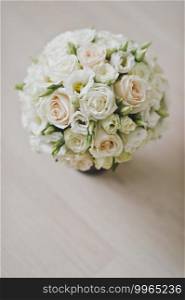 Brides bouquet in soft colors of white roses and buds.. Delicate wedding bouquet in pastel colors of roses and buds 2507.