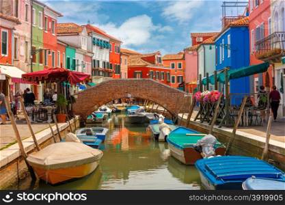Bridge and canal with colorful houses on the famous island Burano, Venice, Italy