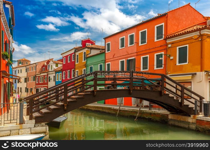 Bridge and canal with colorful houses on the famous island Burano, Venice, Italy