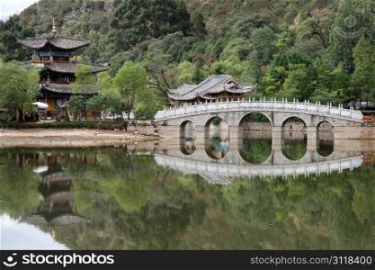 Bridge and pagoda in Black Dragon park in Lijiang, China