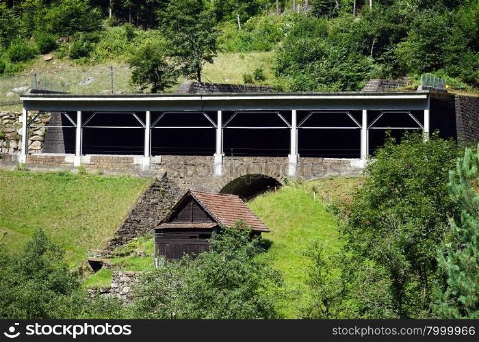 Bridge and railroad near river in mountain area, Switzerland