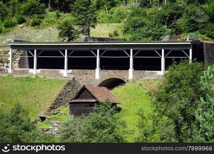 Bridge and railroad near river in mountain area, Switzerland
