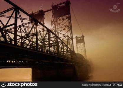 Bridge in Fog With Rosy, Golden Sky