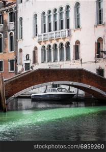 Bridge in Venice, Italy and Historical Building Facade in Background;