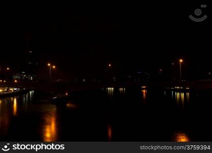 Bridge, King Prajadhipok. During the night with lights and tall buildings.