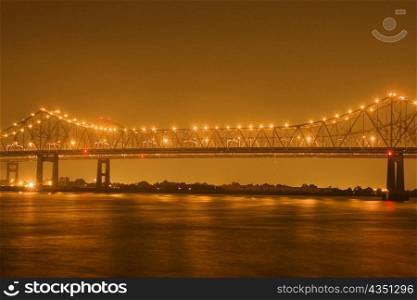 Bridge lit up at night, Mississippi River, New Orleans, Louisiana, USA