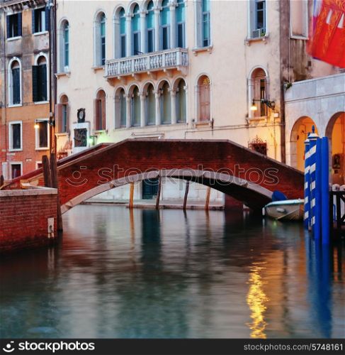 Bridge on the canal in Venice at night.