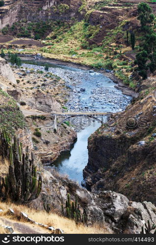 bridge over a mountain river in Peru