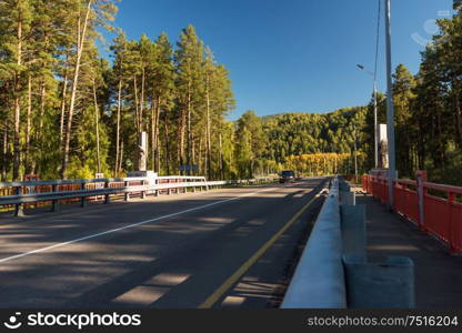 Bridge over a mountain river Katun, Altai Mountains, Russia.. Bridge over a mountain river Katun