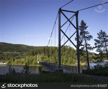 bridge over Leira fjord in norway with blue sky background