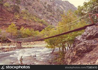 Bridge over river in autumn mountains, Turkey