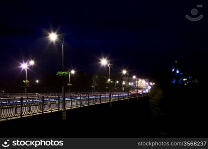 bridge over Smotrych River in Kamianets-Podilskyi, Ukraine, at night