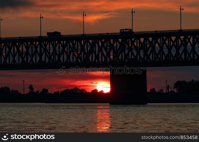 Bridge over the Amur river at sunset. Russia. Khabarovsk. Photo from the middle of the river. Bridge over the Amur river at sunset. Russia. Khabarovsk. Photo from the middle of the river.