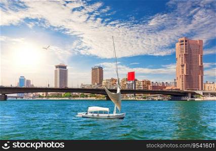 Bridge over the Nile, river board and fancy buildings of Cairo, beautiful day view, Egypt.