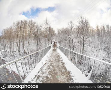 bridge over the river in winter. Russia