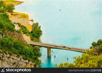 Bridge over the Sainte Croix Lake, Verdon Gorge in french Alps mountains, Provence France. Holidays trip.. Lake Sainte Croix in Verdon Gorge, France