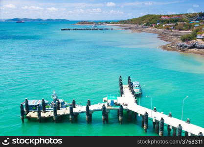 Bridge pier. In the sea near the island. Shipping docks.