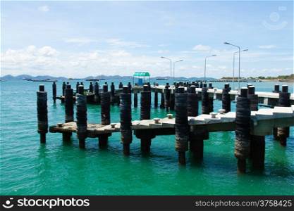 Bridge pier. In the sea near the island. Shipping docks.