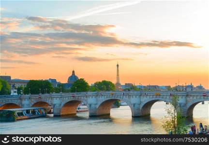 bridge Pont Neuf and Seine river at pink summer sunset, Paris, France. Pont des Arts, Paris, France